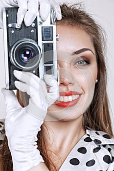 Woman with old photo camera