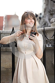 Woman in old town Gdansk with phone