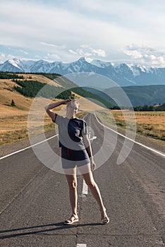 Woman om the Chuysky trakt road in the Altai mountains.