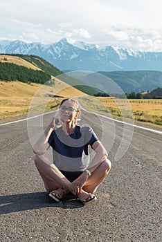 Woman om the Chuysky trakt road in the Altai mountains.