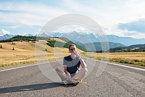 Woman om the Chuysky trakt road in the Altai mountains.