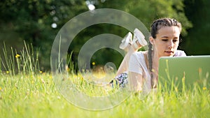 Woman online work outside. Laptop, computer business technology. Student girl working on tablet in summer nature park