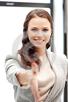 Woman with an open hand ready for handshake