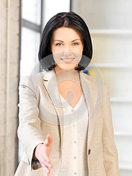 Woman with an open hand ready for handshake