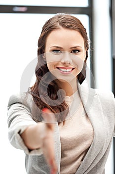 Woman with an open hand ready for handshake