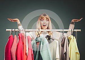 Woman with open hands palms in mall or wardrobe.