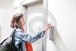 Woman open the Hotel door with electronic key