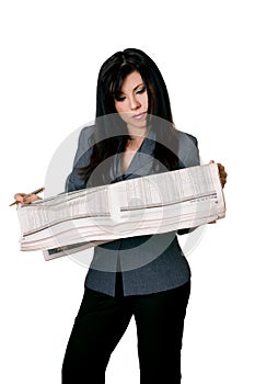 Woman with open newspaper reading.