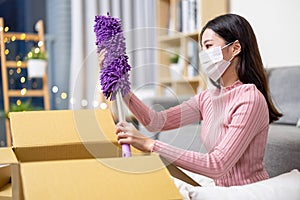 Woman open online shopping parcel