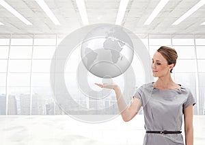 Woman with open palm hand under world earth globe