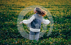 Woman with open up arms, dancing. Hands up. Free girl, amazing summer adventure