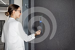 Woman opening the door with keychain