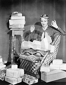 Woman opening gifts