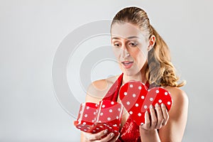 Woman opening present for valentines day