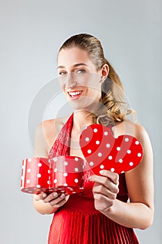 Woman opening present for valentines day