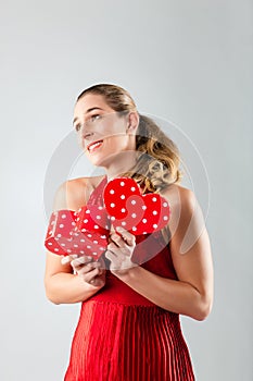 Woman opening present for valentines day