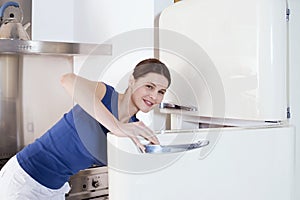 Woman opening the refrigerator