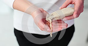 Woman opens a bag with golden transparent diamonds