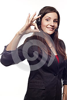 Woman operator with headset showing hand ok sign