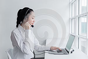 Woman operators with microphone and computer laptop at work, Call center, support telemarketing. communication receptionist
