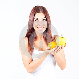 Woman with orange and apple in hands. Healthy lifestyle.