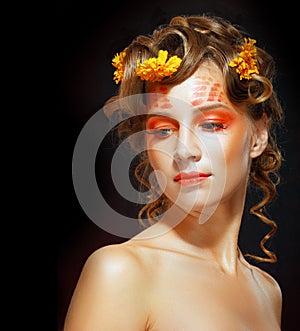 Woman with orange artistic visage