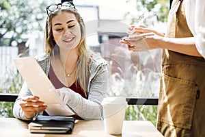 Woman ordering food at the restaurant