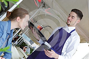 Woman ordering to waiter