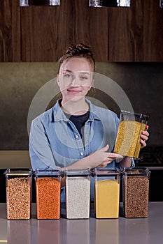Woman organizing food in the kitchen with containers