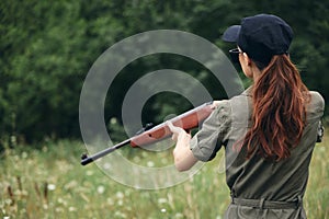 Woman on outdoor Holding a weapon is a hunting lifestyle black cap