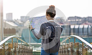 Woman outdoors holding map