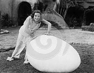 Woman outside with giant egg