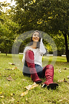 Beautyfull woman outside in the park autumn sesason photo