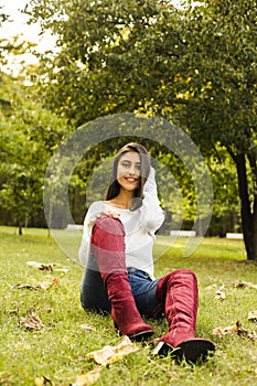 Beautyfull woman outside in the park autumn sesason photo