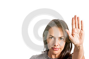 Woman with outstretched hand showing stop gesture isolated