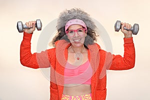 Senior woman working out dumbbells 80s look Sweatband photo