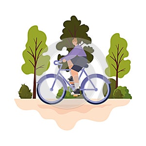 woman over a purple bycicle on a park