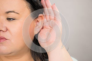 Woman overhearing listening to rumors