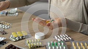 Woman overusing and mixing pills for self-treatment, dangerous side effects