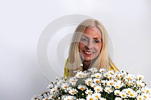 Woman with oxeye daisy photo