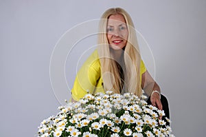 Woman with oxeye daisy flowers