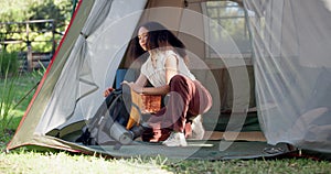 Woman, packing and backpack for outdoor hiking, camping trip or adventure in nature, park or tent in the woods. Summer