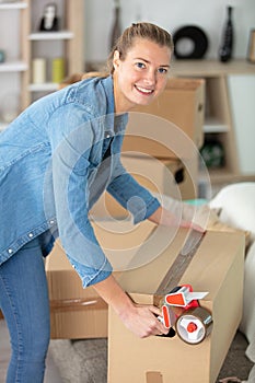 woman packing boxes for moving home