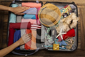 Woman packing a luggage for a new journey