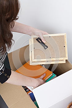 Woman packing photo frames