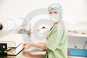 Woman packing and sealing medical tools