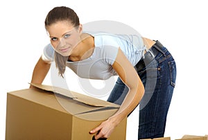 Woman packing/unpacking boxes