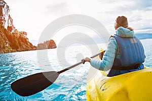 Woman paddles kayak