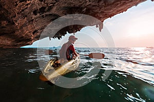 Woman paddles kayak