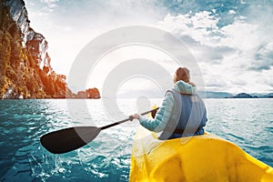 Woman paddles kayak on the lake of General Carrera
